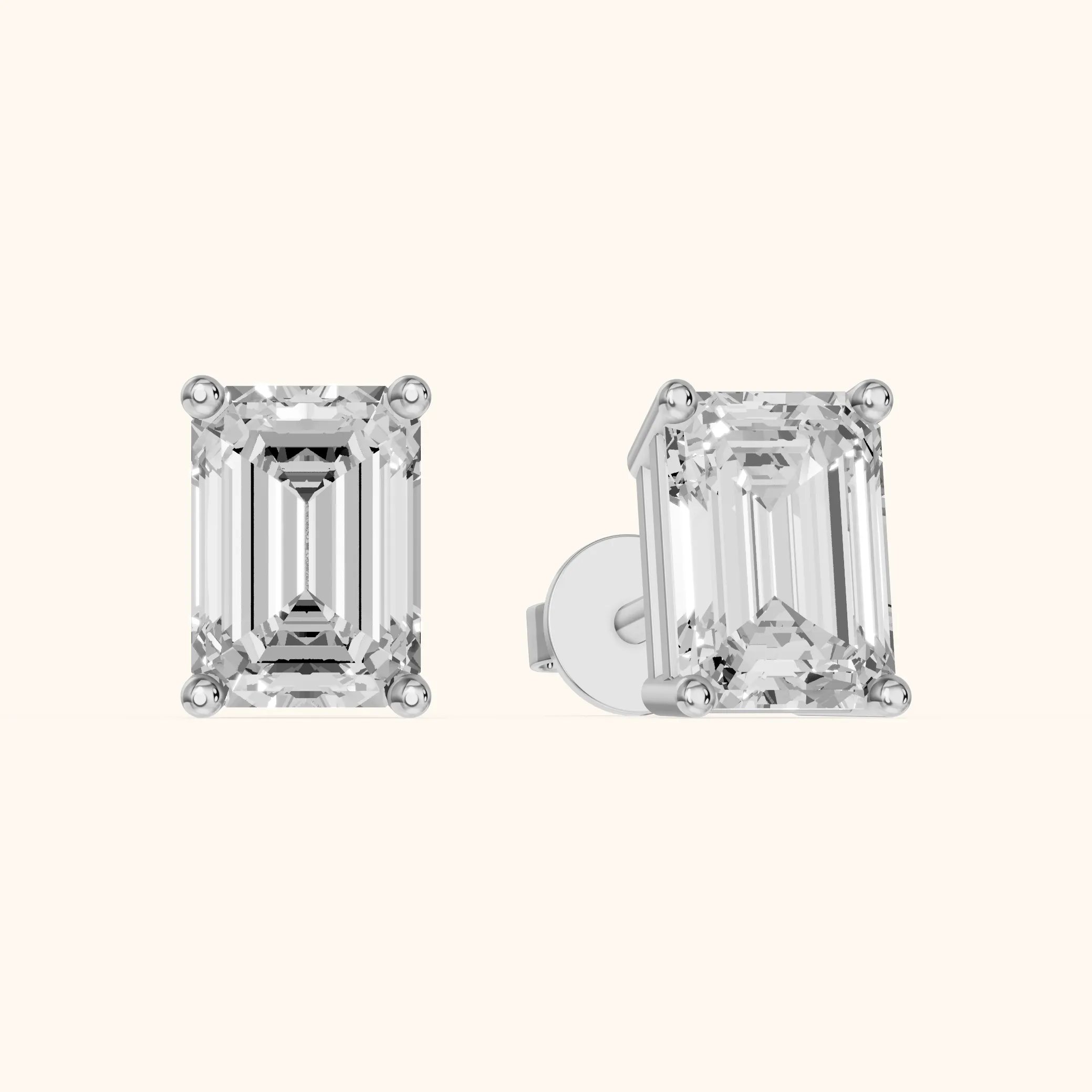 Four Prong Emerald Diamond Stud Earrings in Platinum — view 1