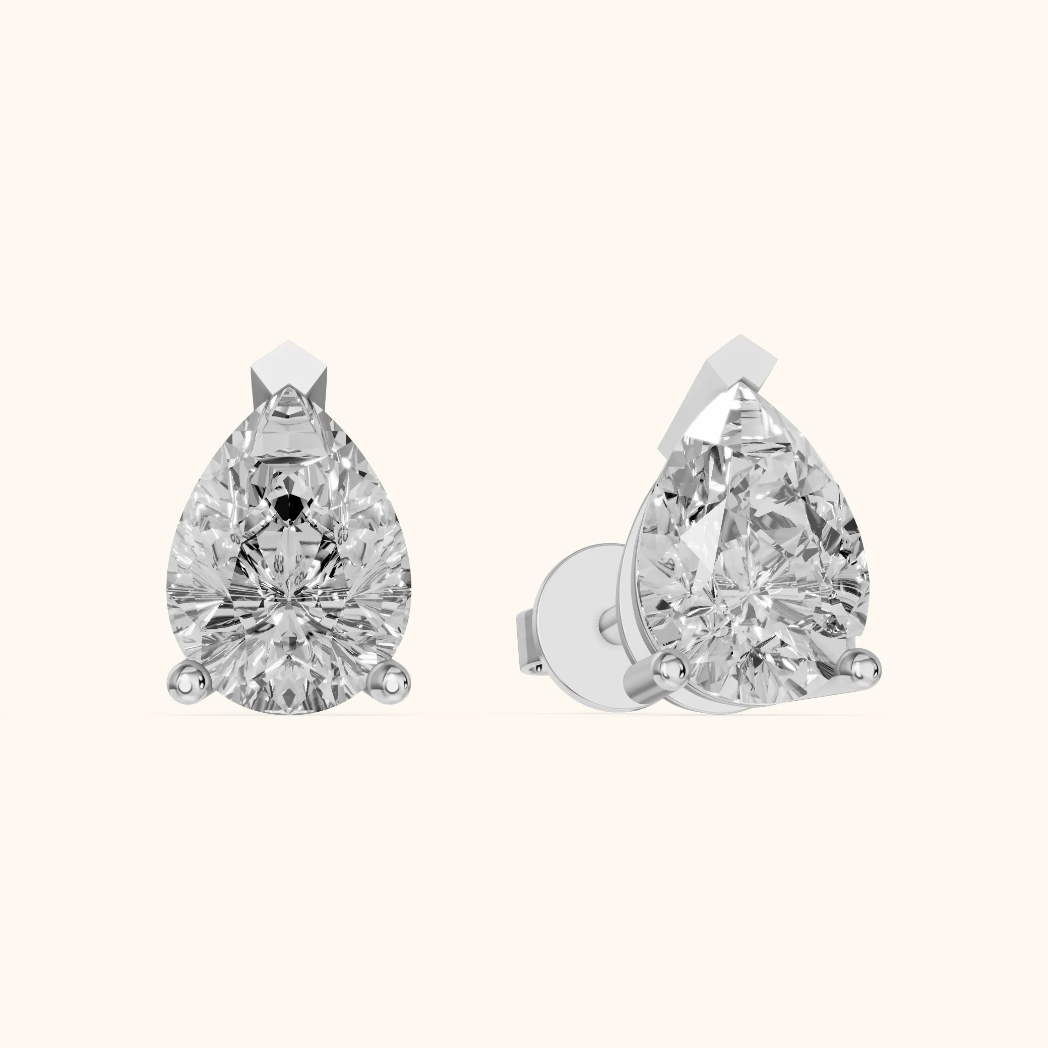 Four Prong Pear Diamond Stud Earrings in Platinum — view 1