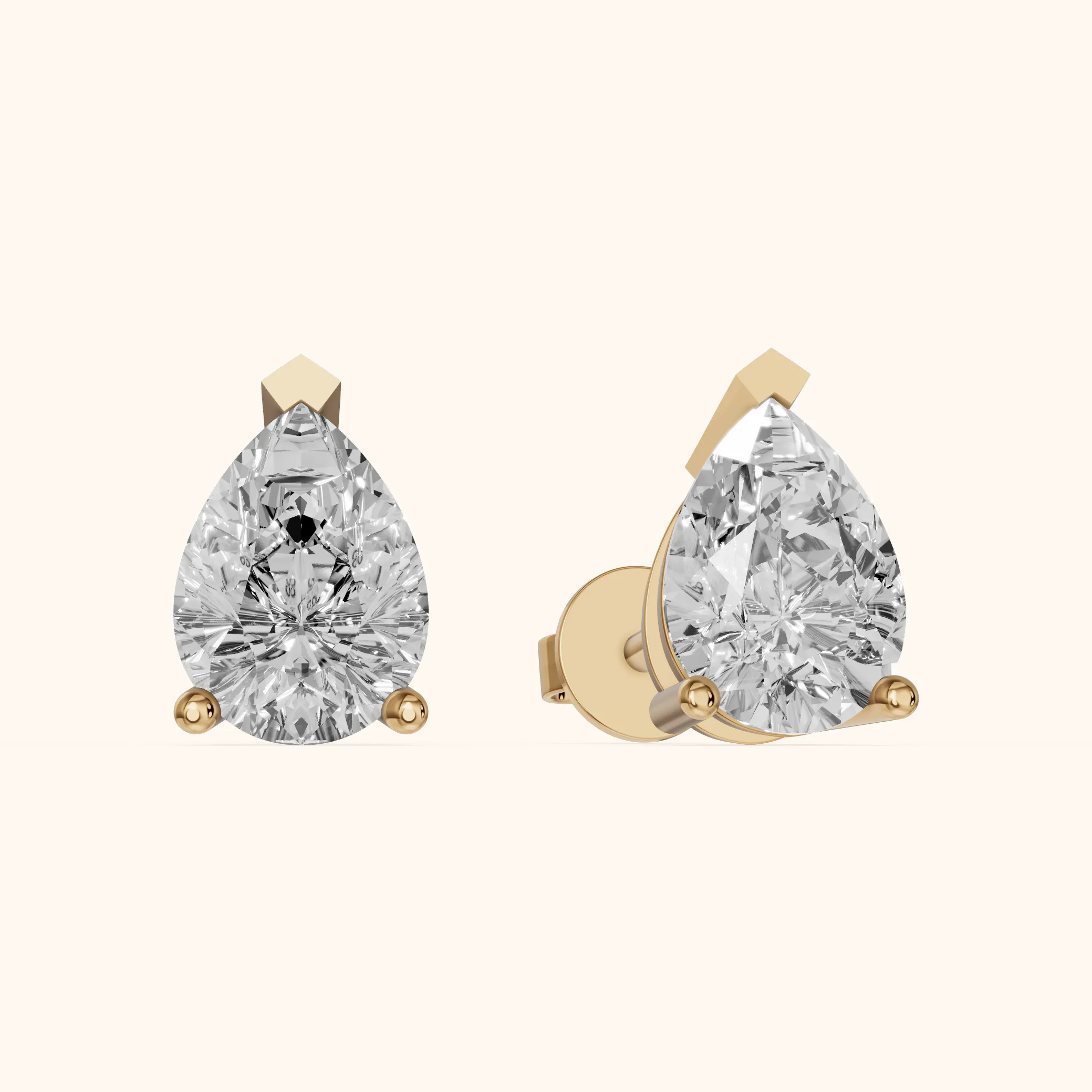 Four Prong Pear Diamond Stud Earrings in Yellow Gold — view 1