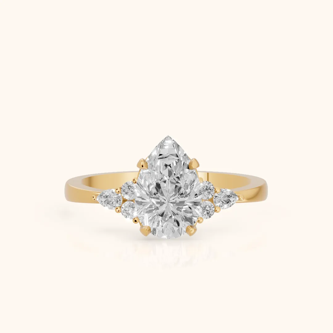Amelia Three Stone Pear Diamond Engagement Ring in Yellow Gold