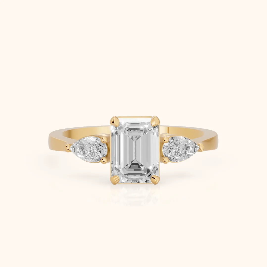 Grace Three Stone Emerald Diamond Engagement Ring in Yellow Gold