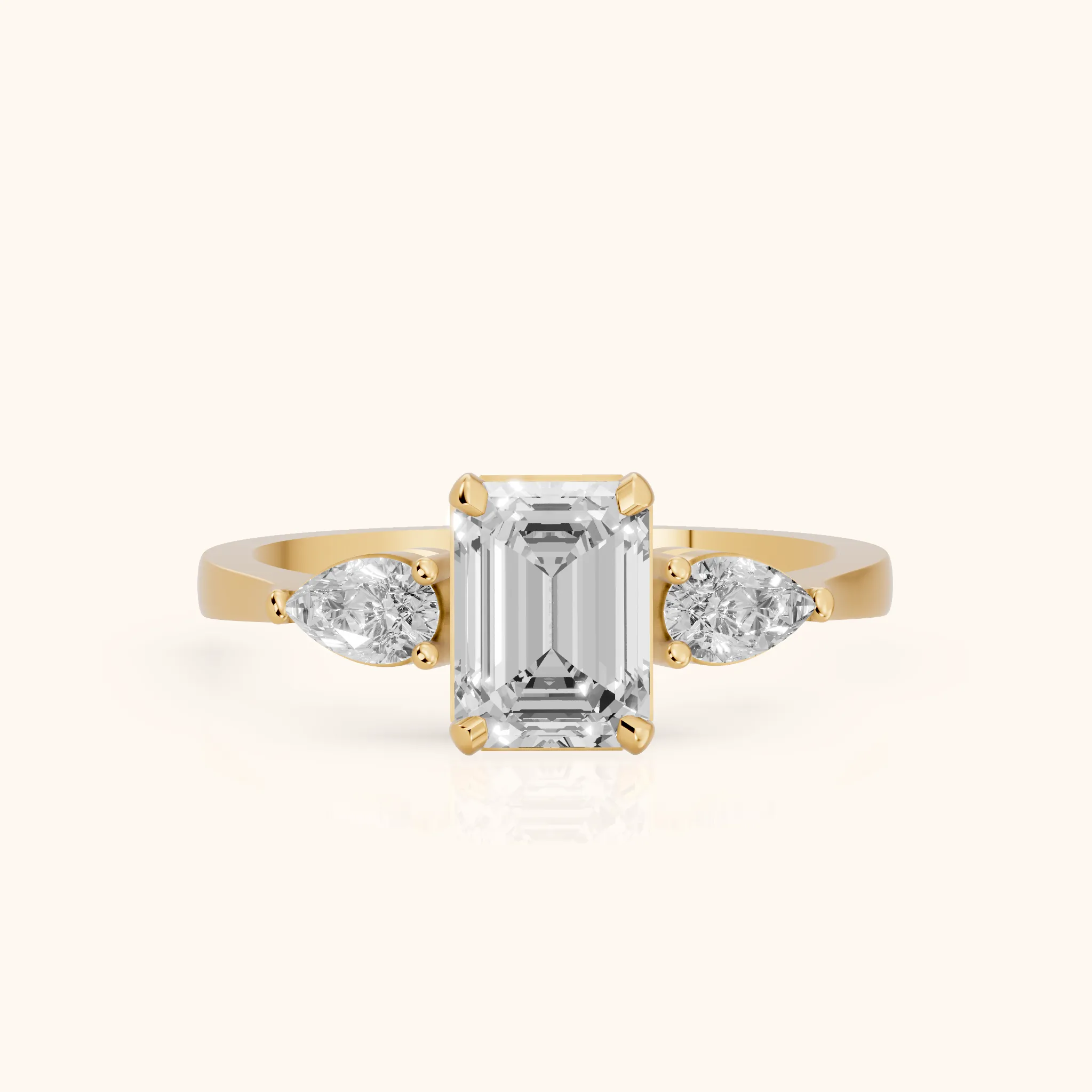 Grace Three Stone Emerald Diamond Engagement Ring in Yellow Gold — view 1