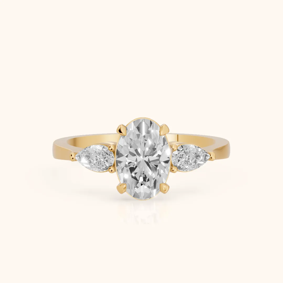 Grace Three Stone Oval Diamond Engagement Ring in Yellow Gold