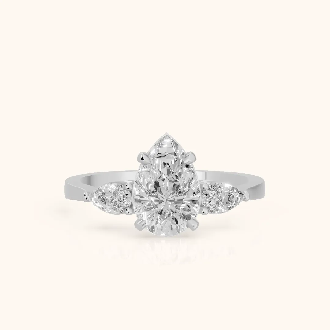 Grace Three Stone Pear Diamond Engagement Ring in Platinum