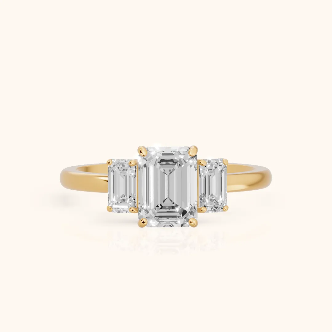 Marian Three-Stone Hidden Halo Emerald Diamond Engagement Ring in Yellow Gold — view 2
