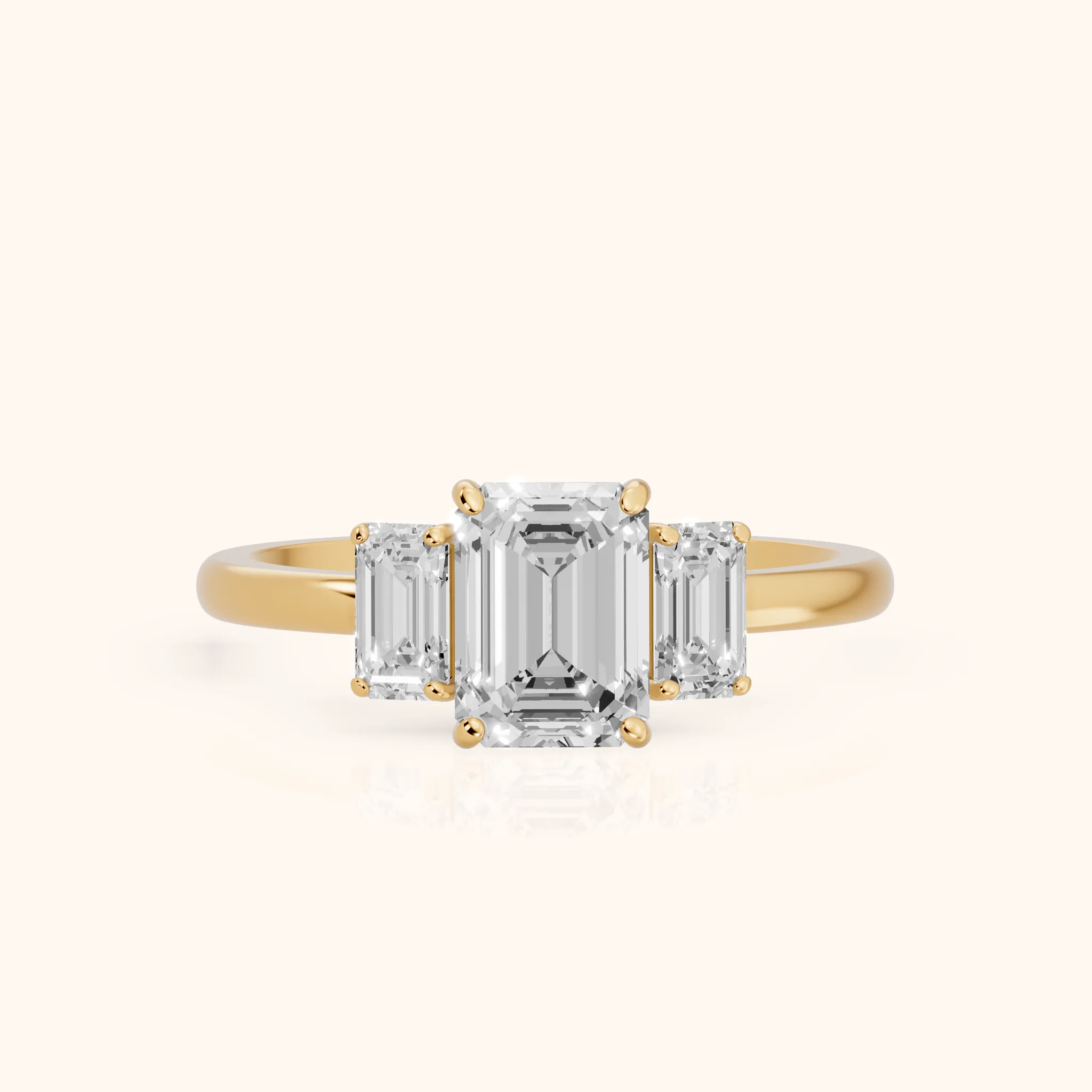 Marian Three-Stone Hidden Halo Emerald Diamond Engagement Ring in Yellow Gold — view 1