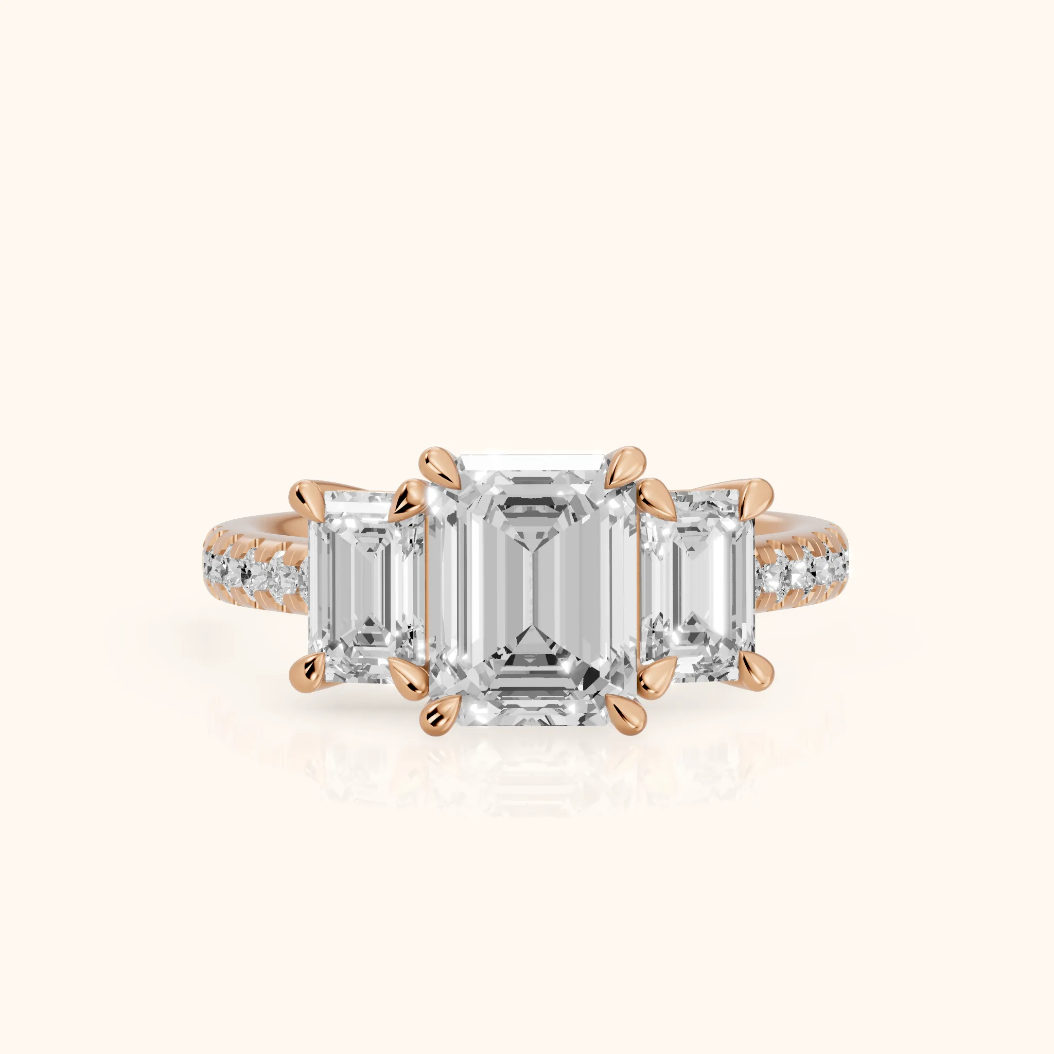 Gabrielle Three-Stone Pavé Emerald Diamond Engagement Ring in Rose Gold — view 1
