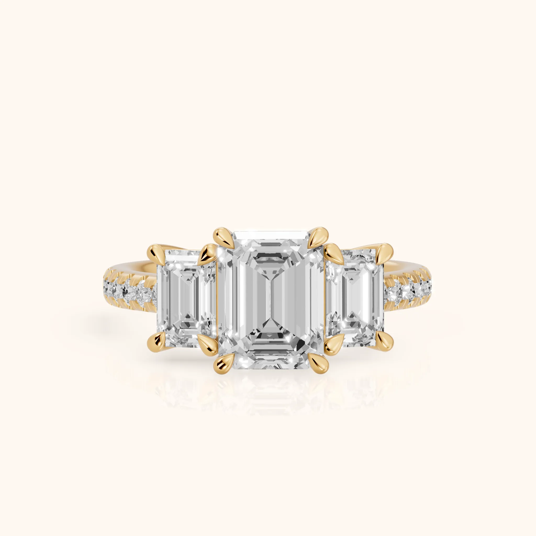Gabrielle Three-Stone Pavé Emerald Diamond Engagement Ring in Yellow Gold — view 1