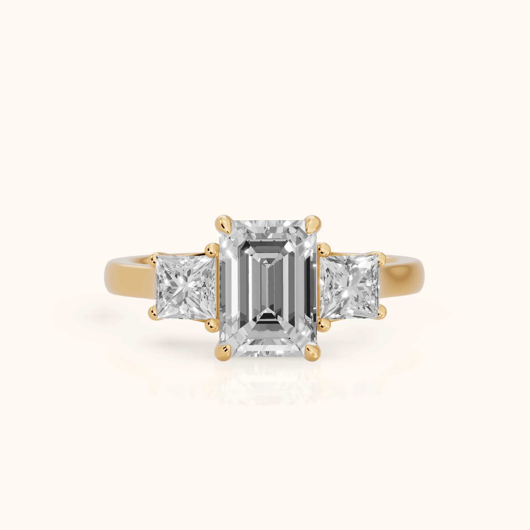 Sienna Three-Stone Emerald Diamond Ring in Yellow Gold — view 1