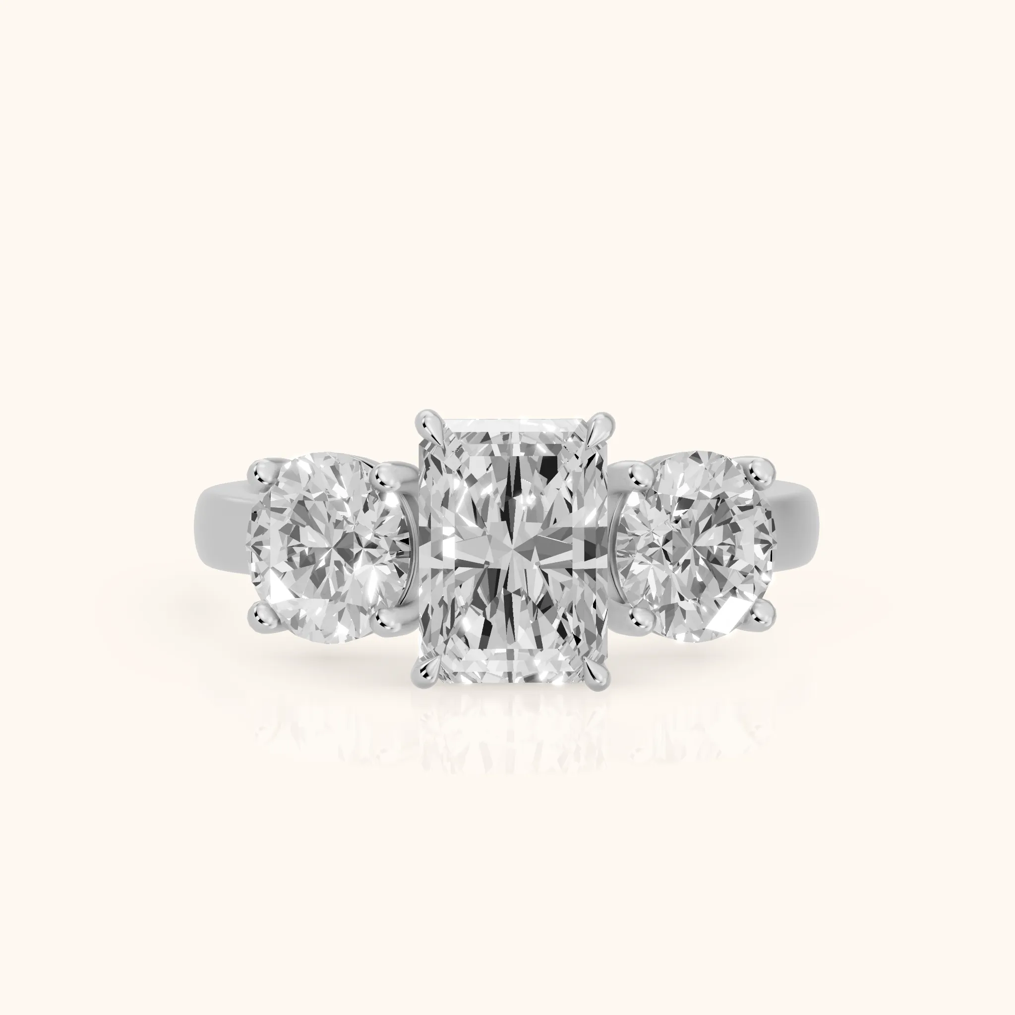 Esme Three-Stone Tapered Emerald Diamond Ring in Platinum — view 1
