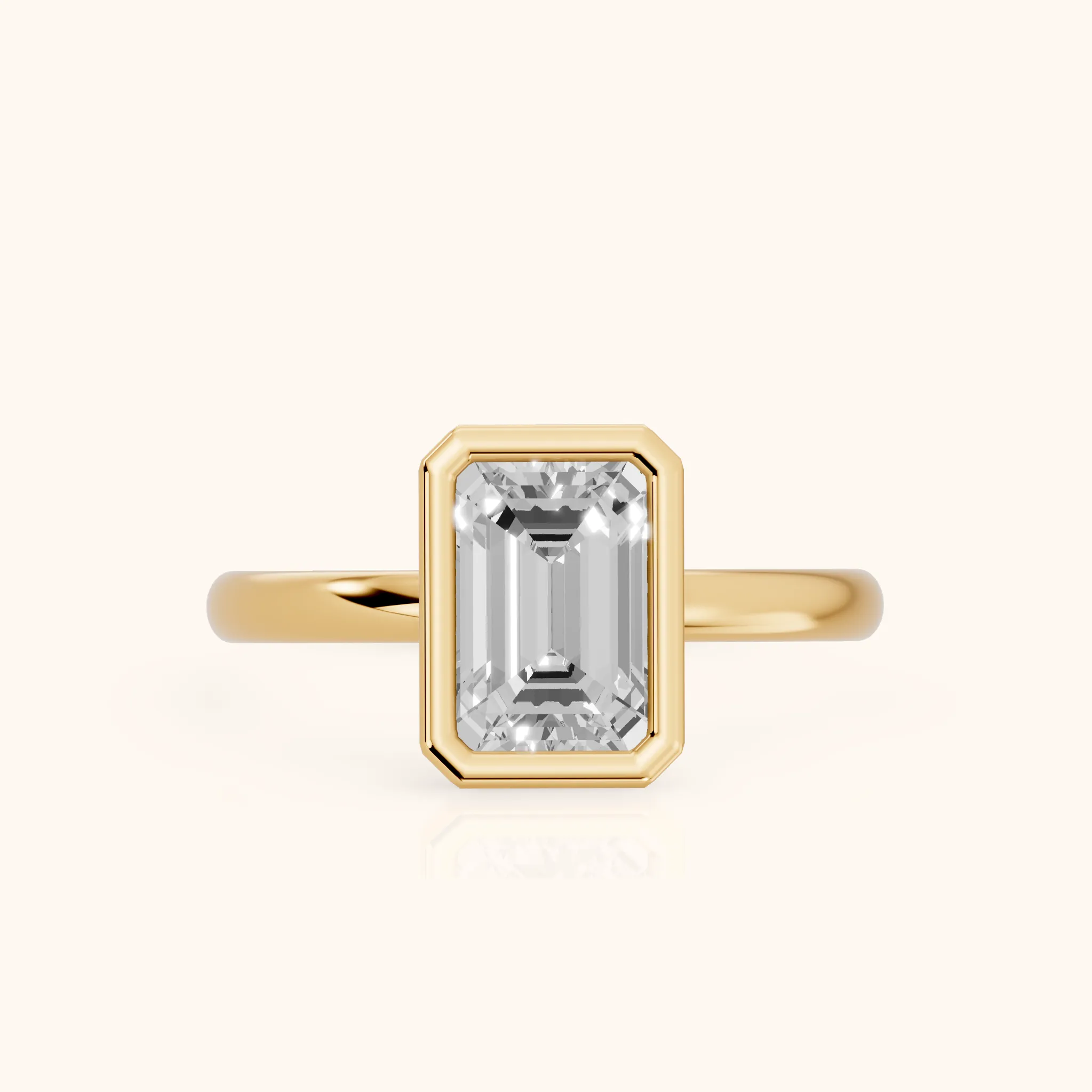 Maeve Bezel Solitaire Emerald Diamond Ring in Yellow Gold — view 1