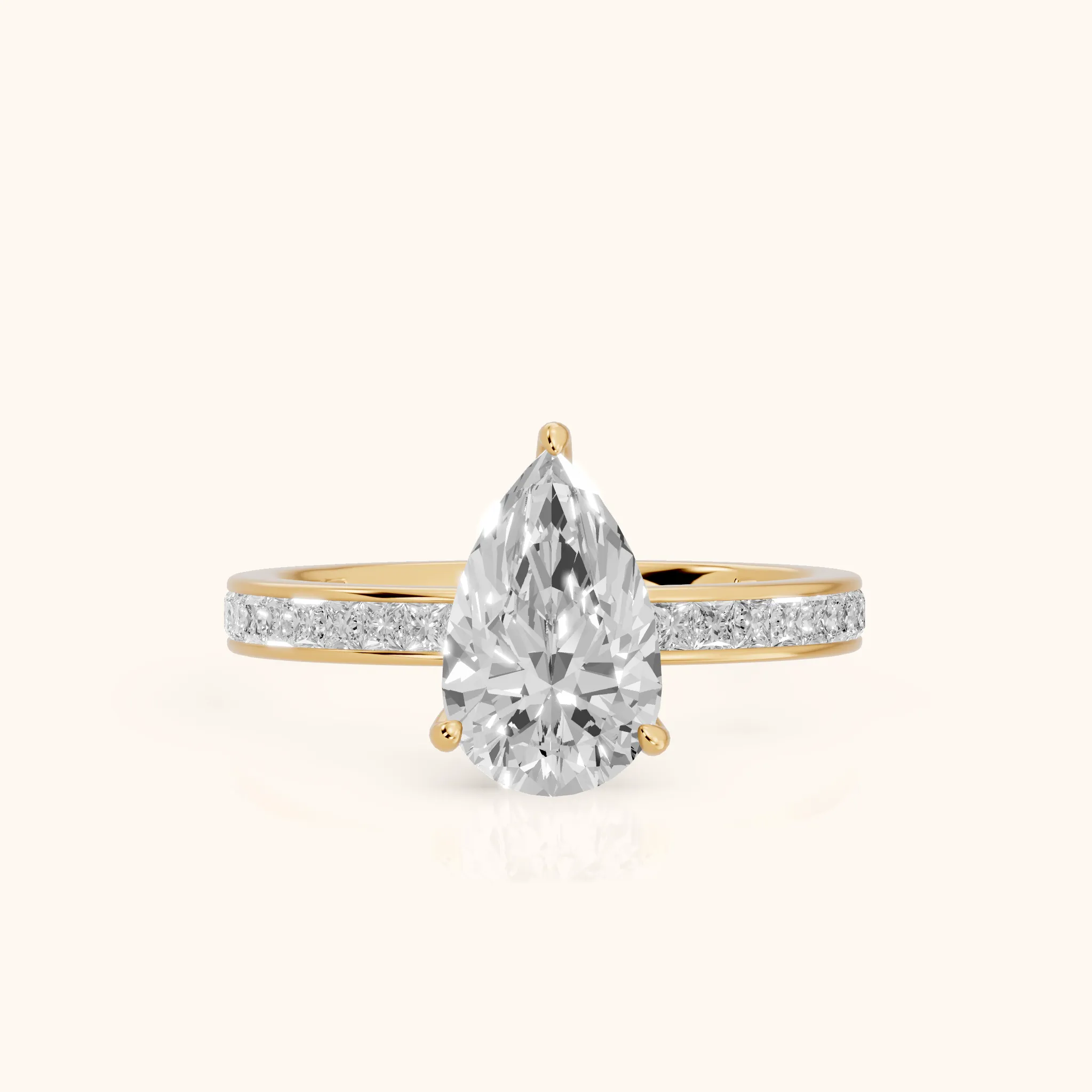Brielle Channel Set Solitaire Pear Diamond Ring in Yellow Gold — view 1