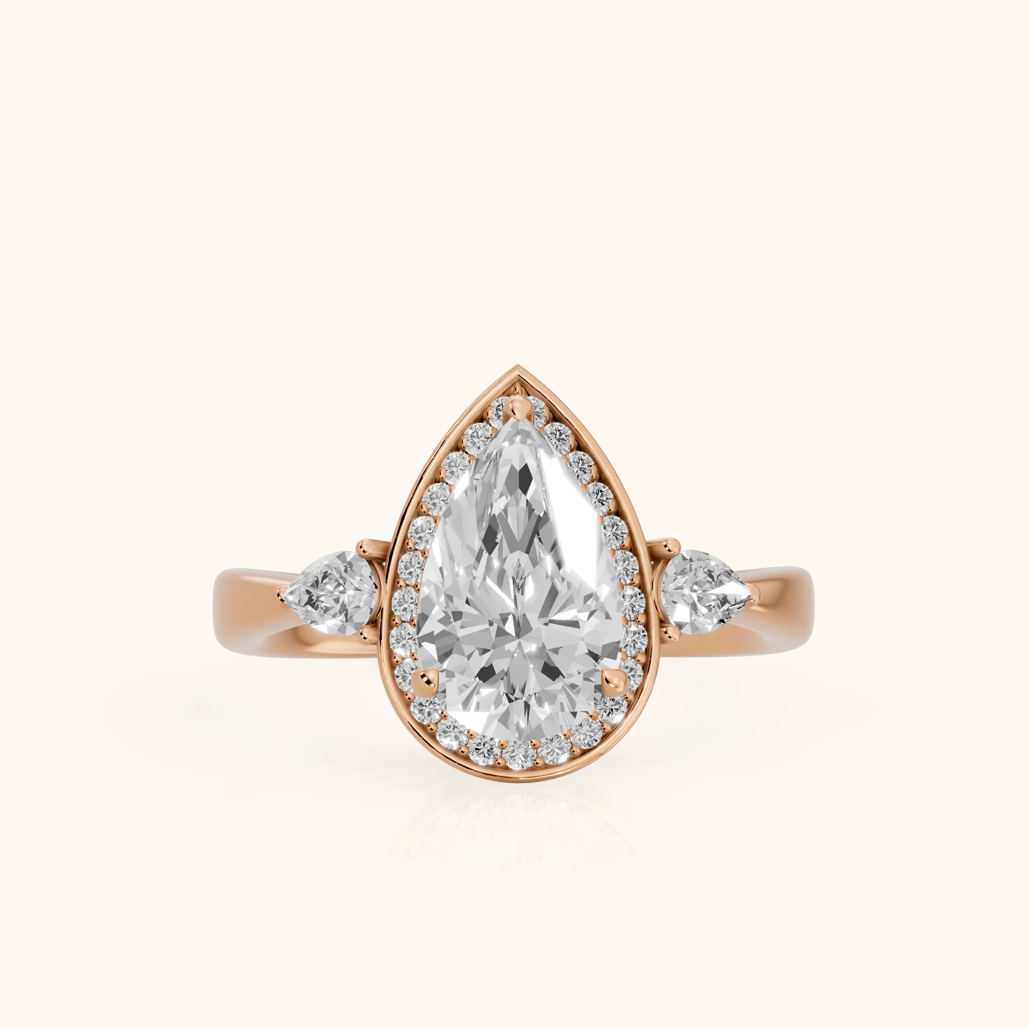 Eliza Halo Sidestone Pear Diamond Engagement Ring in Rose Gold — view 1