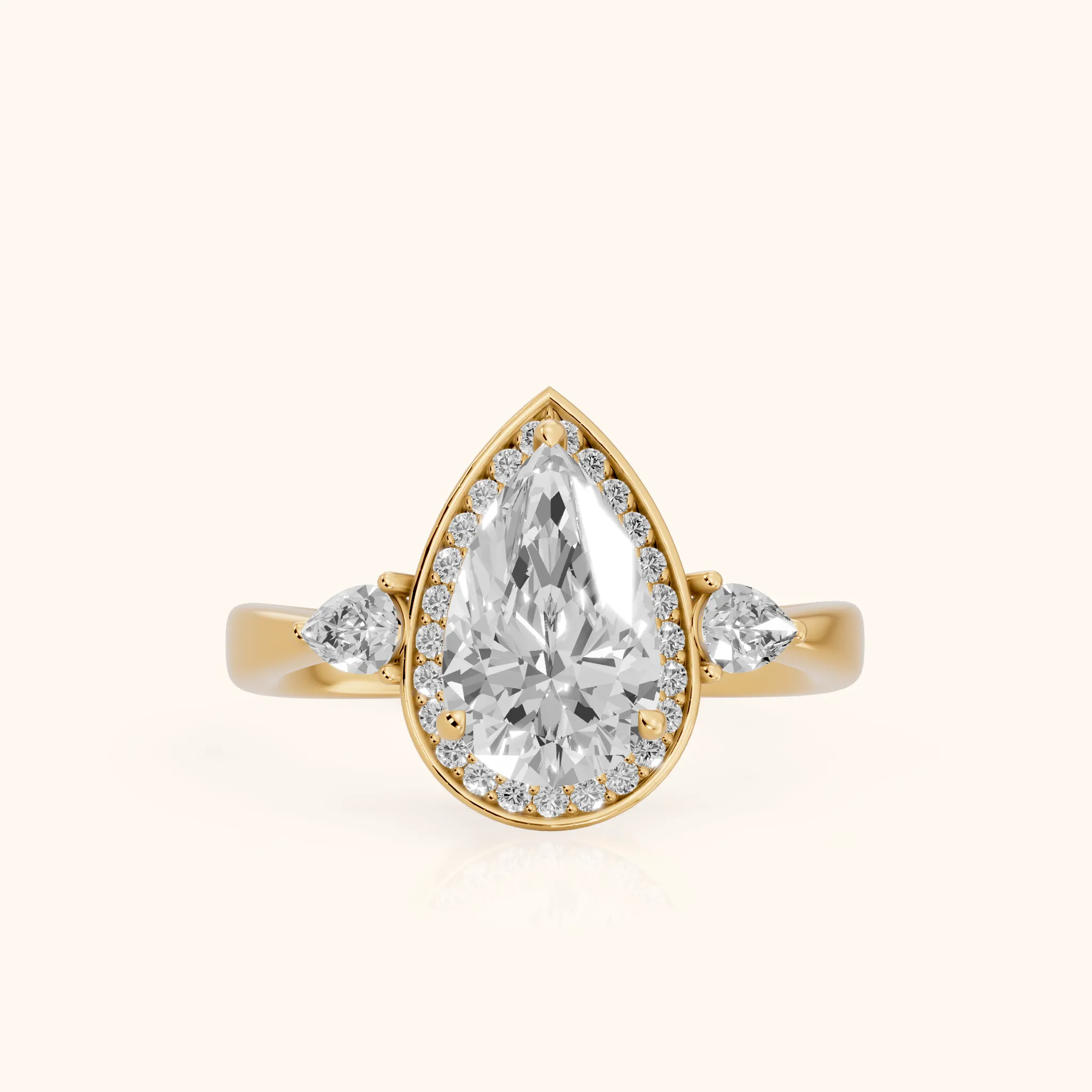 Eliza Halo Sidestone Pear Diamond Engagement Ring in Yellow Gold — view 1