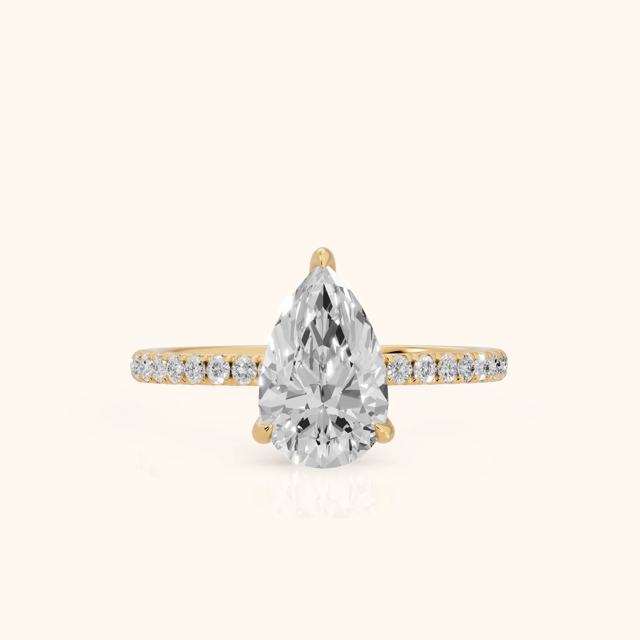 Ione Solitaire Pavé Pear Diamond Engagement Ring in Yellow Gold — view 1