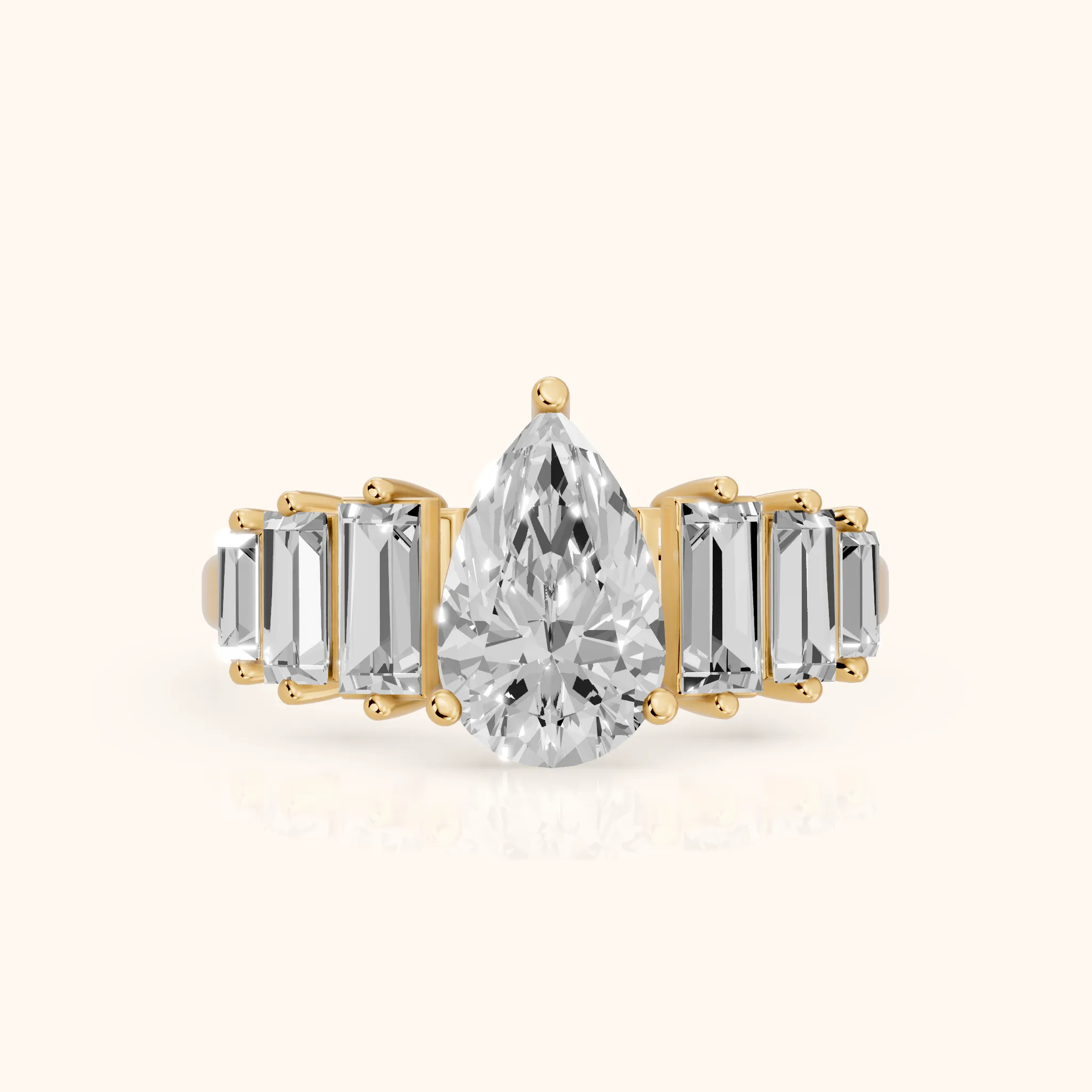 Mara Sidestone Baguette Accent Pear Diamond Engagement Ring in Yellow Gold — view 1