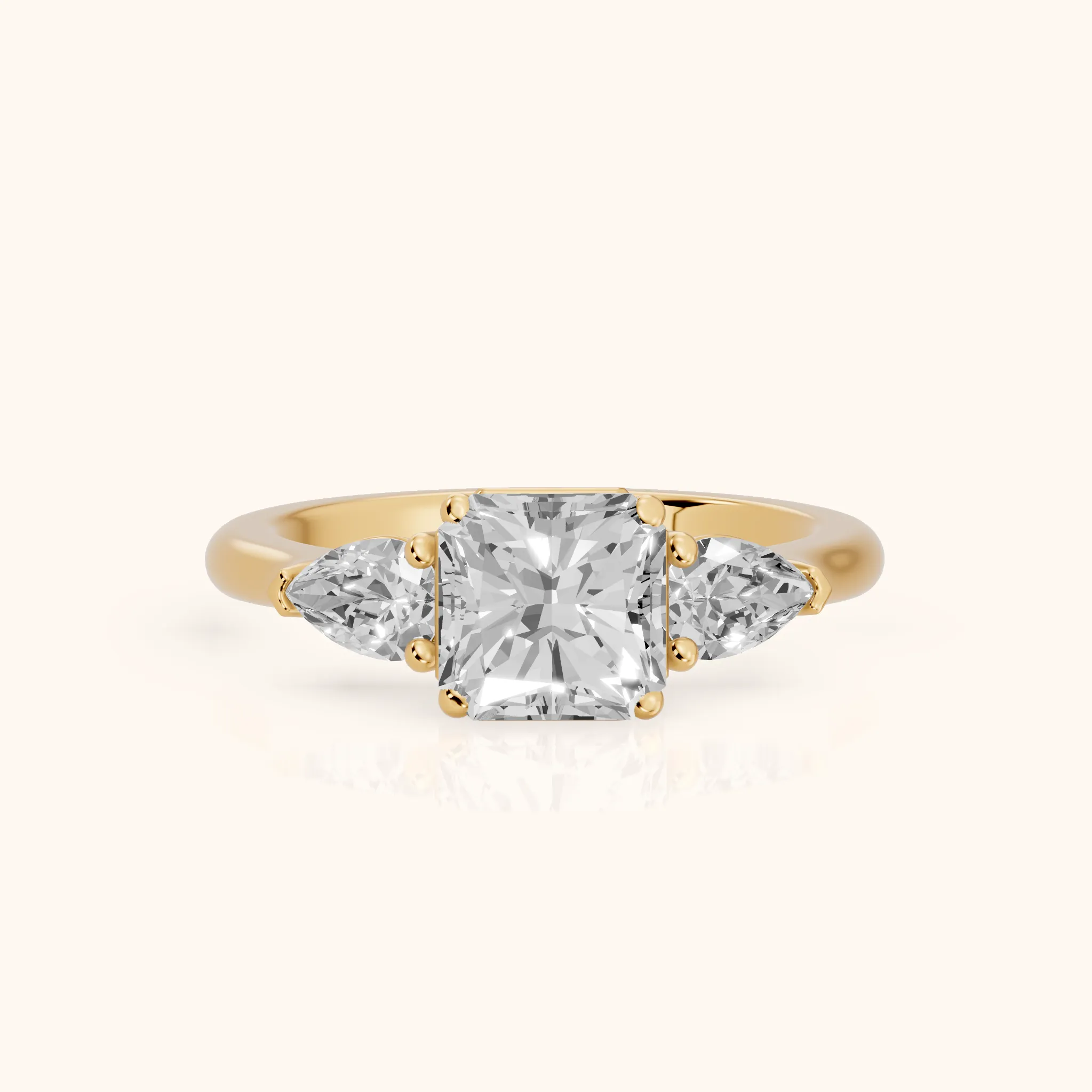 Mirabel Three-Stone Radiant Diamond Engagement Ring in Yellow Gold — view 1