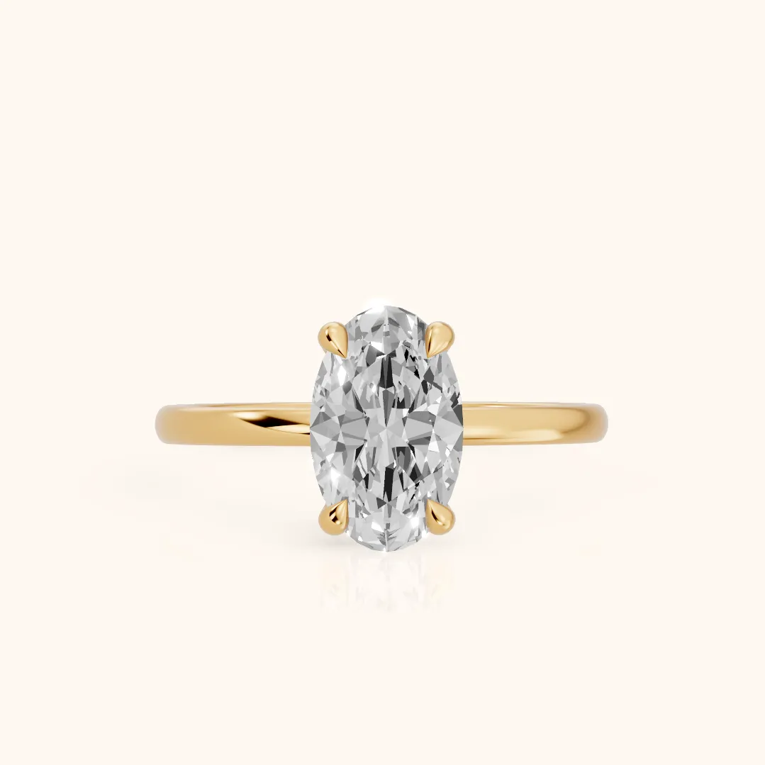 Nella Petite Solitaire Oval Diamond Engagement Ring in Yellow Gold — view 2