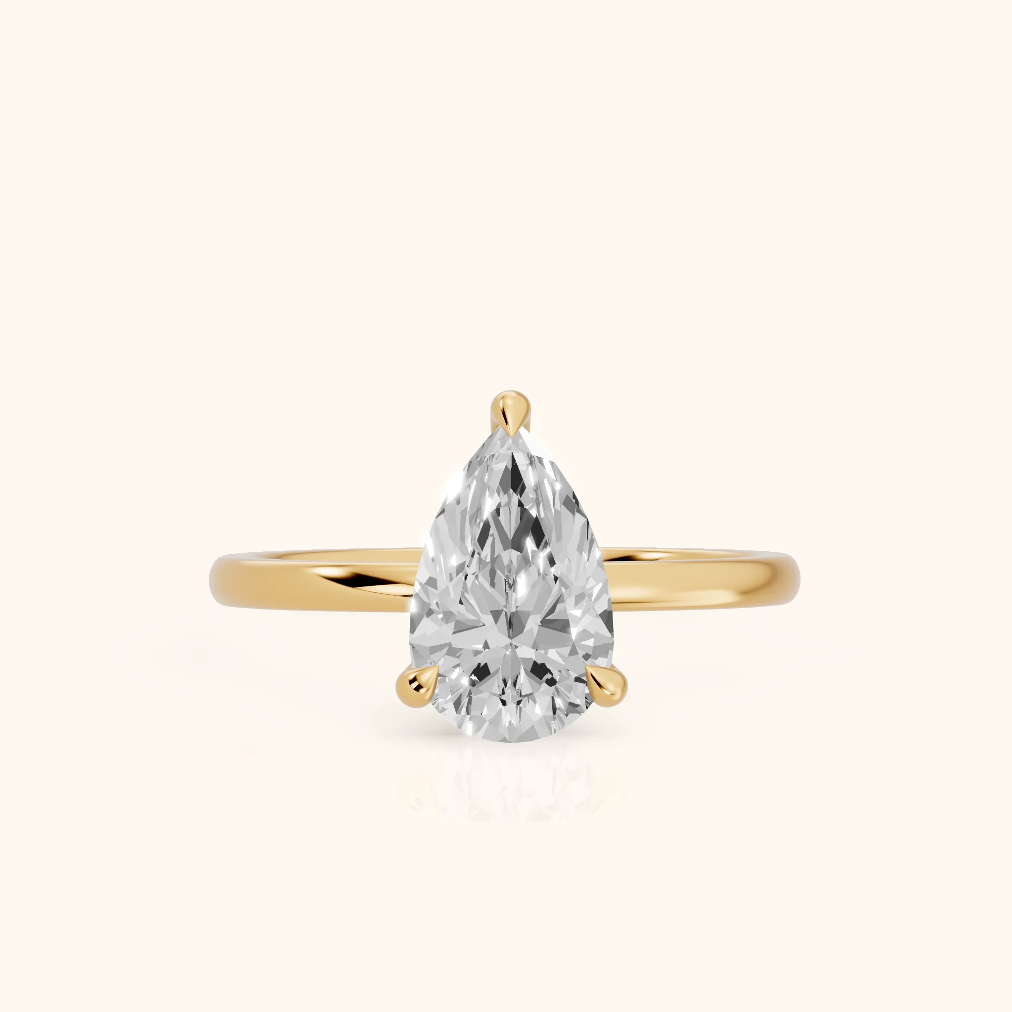Nella Petite Solitaire Pear Diamond Engagement Ring in Yellow Gold — view 1