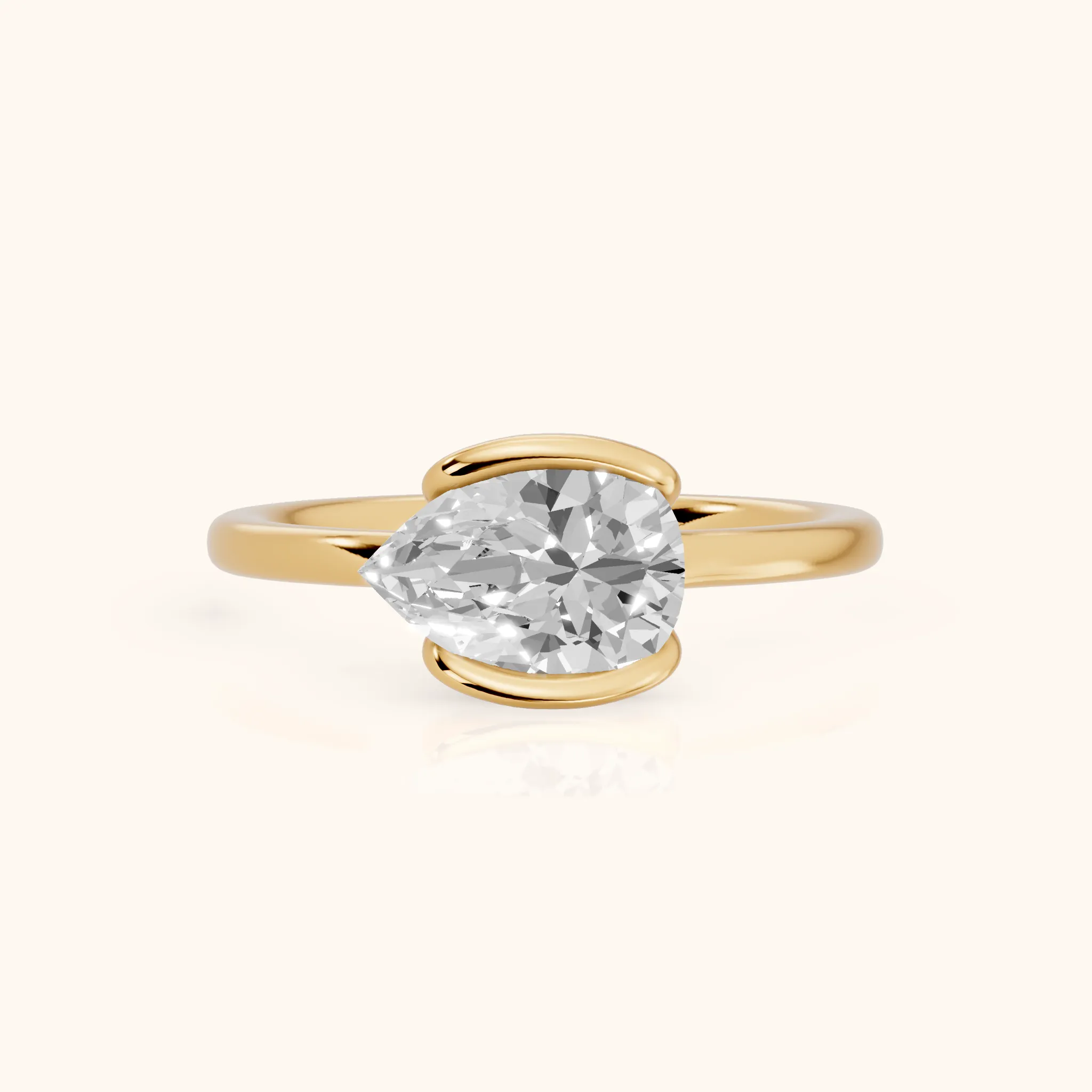 Mathilde East-West Half Bezel Pear Diamond Engagement Ring in Yellow Gold — view 1