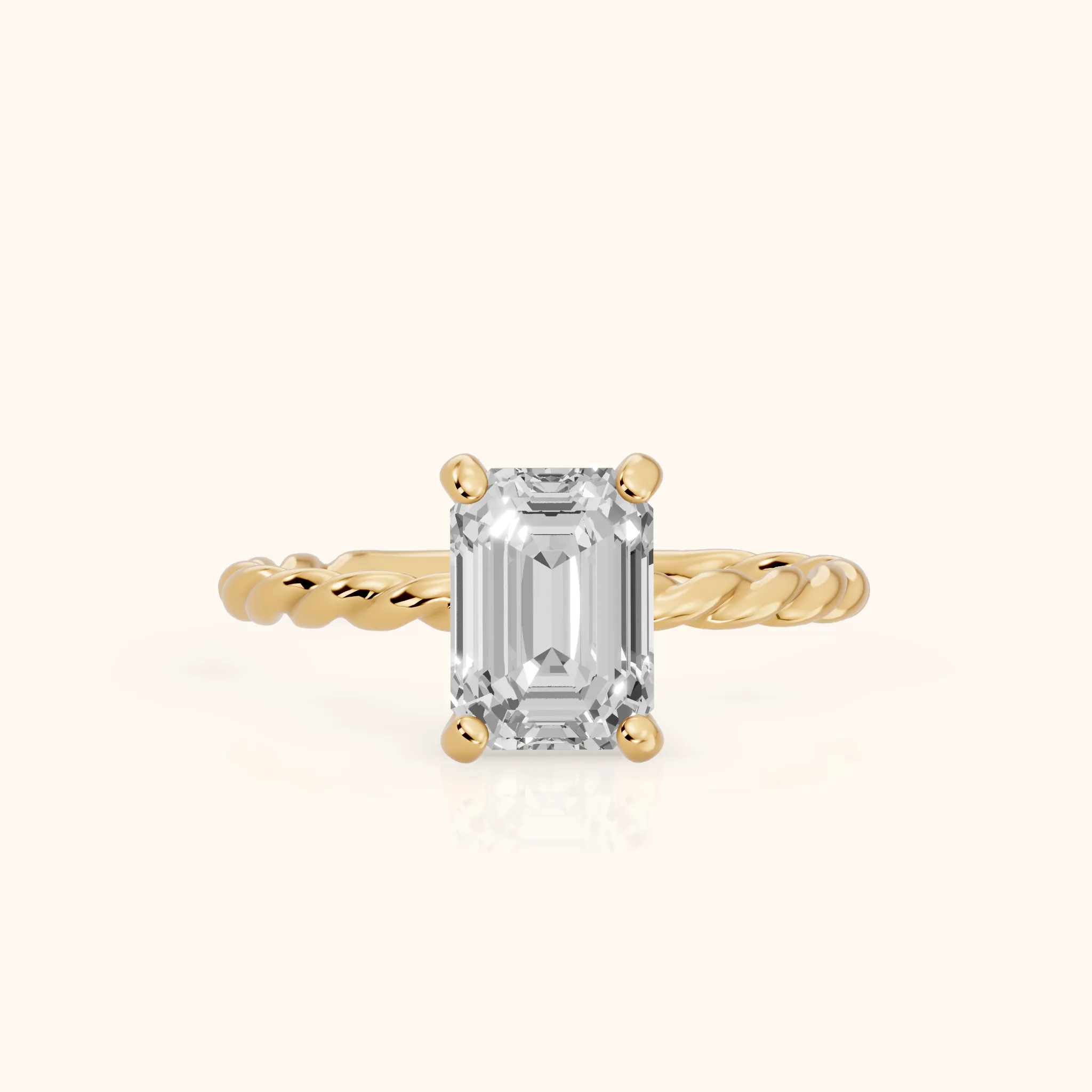 Robyn Twist Solitaire Emerald Diamond Engagement Ring in Yellow Gold — view 1