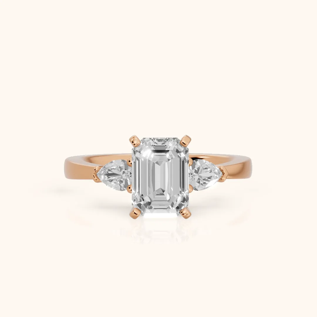 Amabel Three-Stone Emerald Diamond Engagement Ring in Rose Gold — view 2
