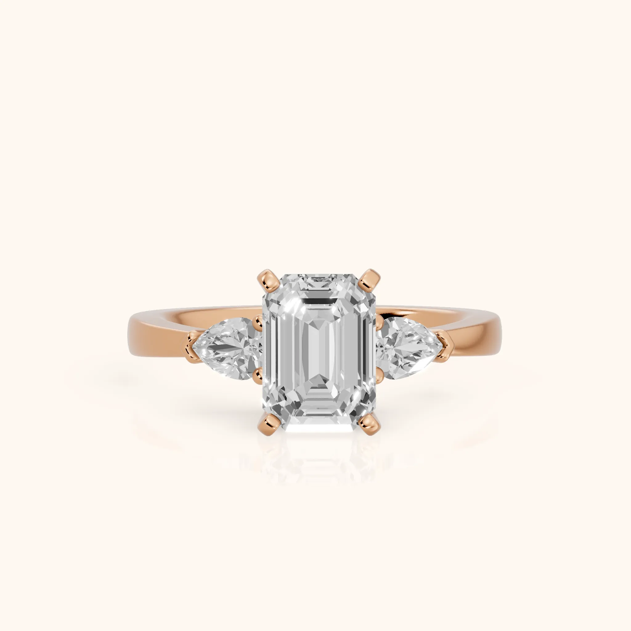 Amabel Three-Stone Emerald Diamond Engagement Ring in Rose Gold — view 1