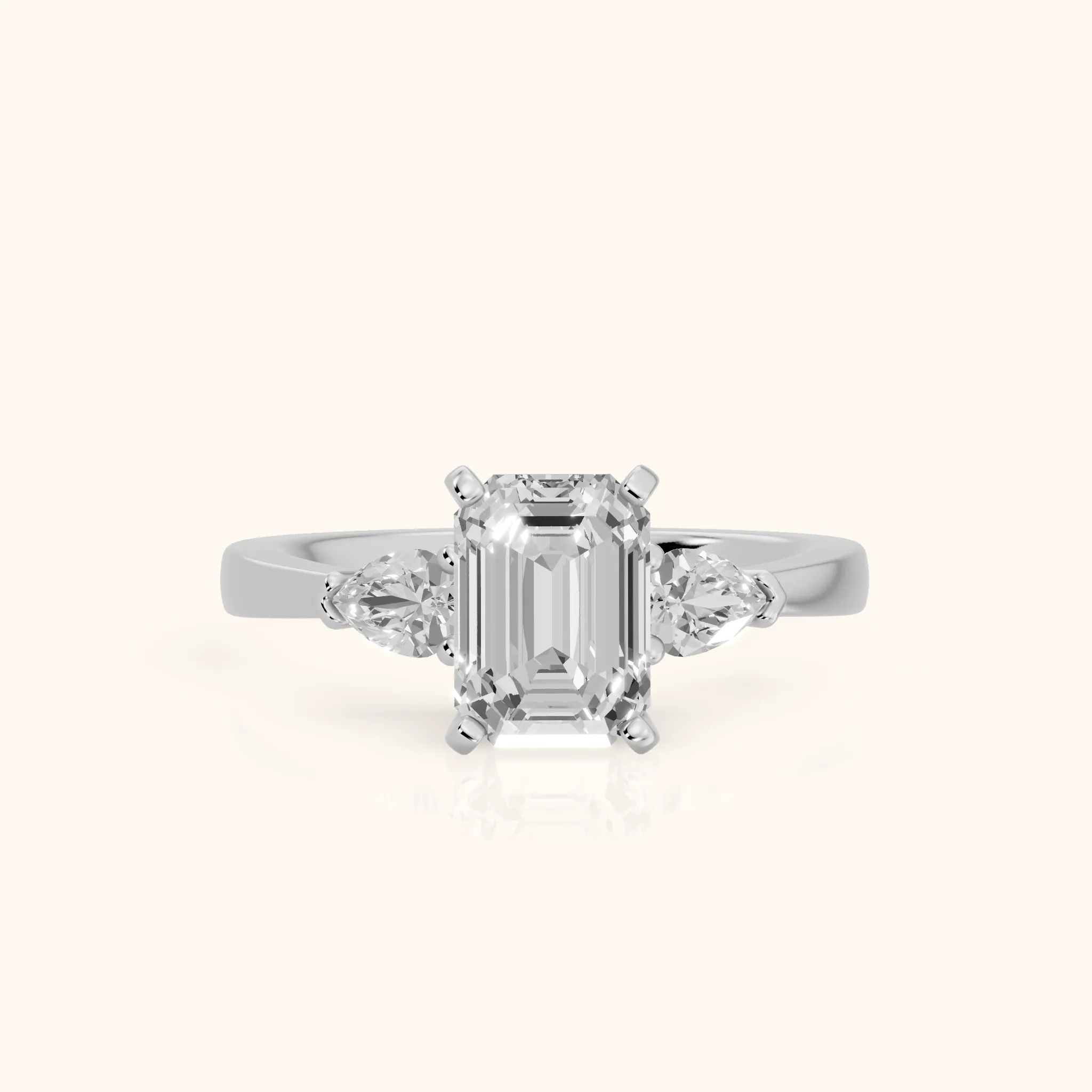 Amabel Three-Stone Emerald Diamond Engagement Ring in Platinum — view 1