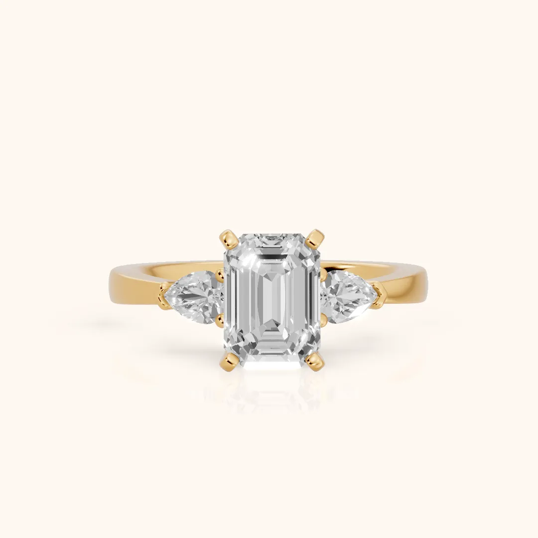 Amabel Three-Stone Emerald Diamond Engagement Ring in Yellow Gold — view 2