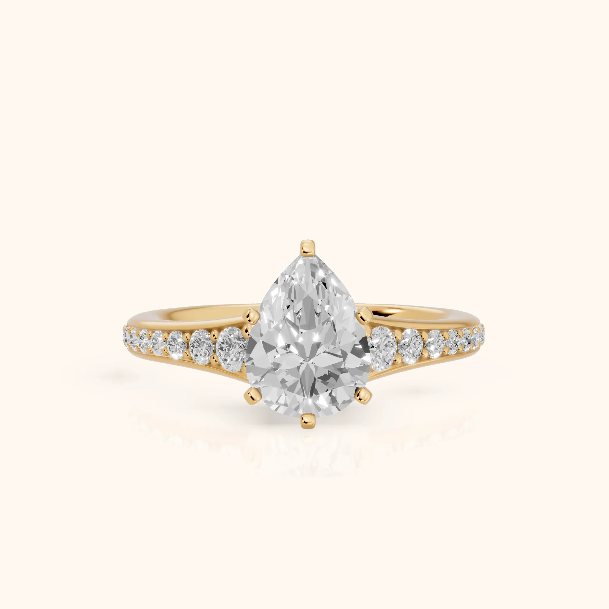 Calista Graduated Pavé Pear Diamond Engagement Ring in Yellow Gold — view 1