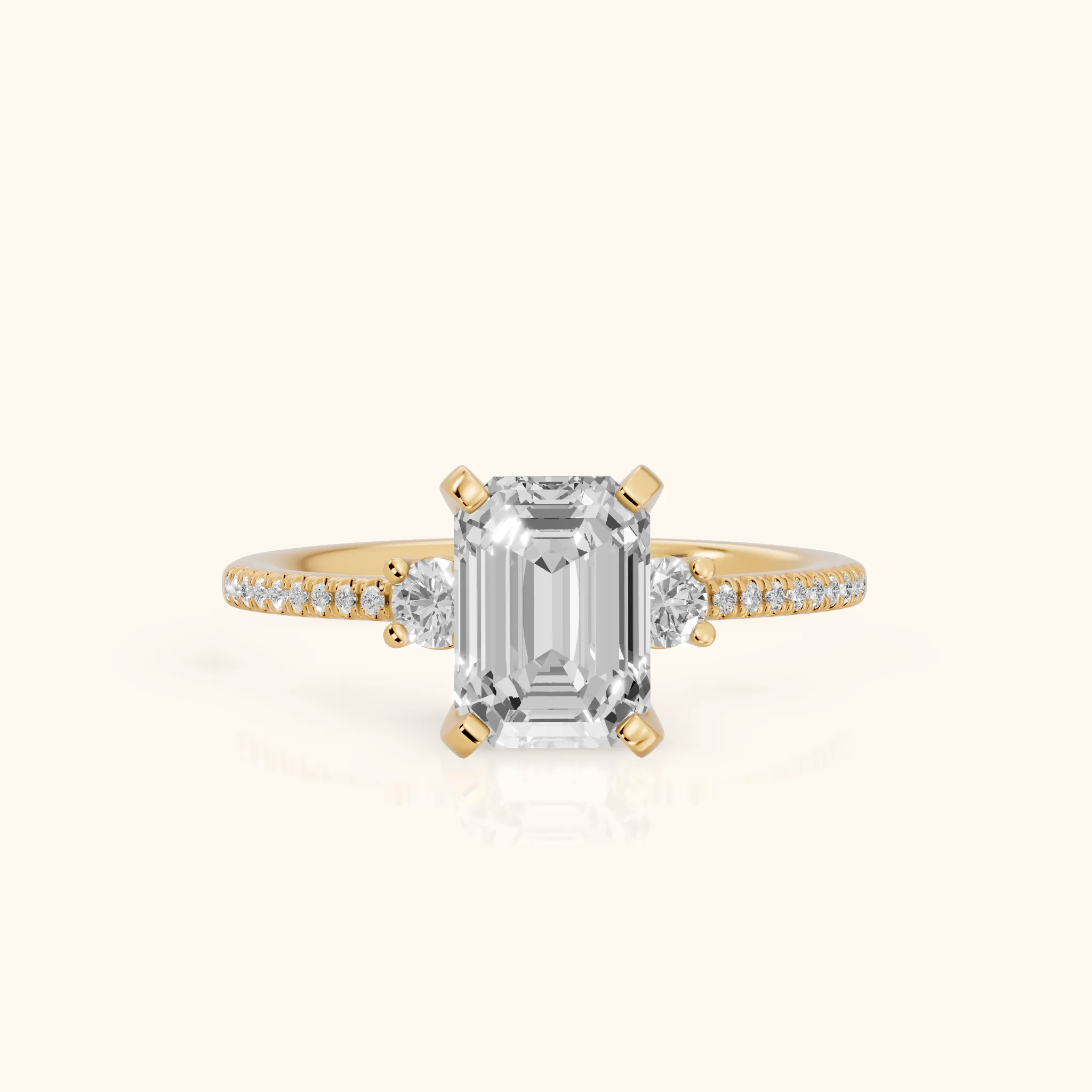 Nerissa Three-Stone Micropavé Emerald Diamond Engagement Ring in Yellow Gold — view 1