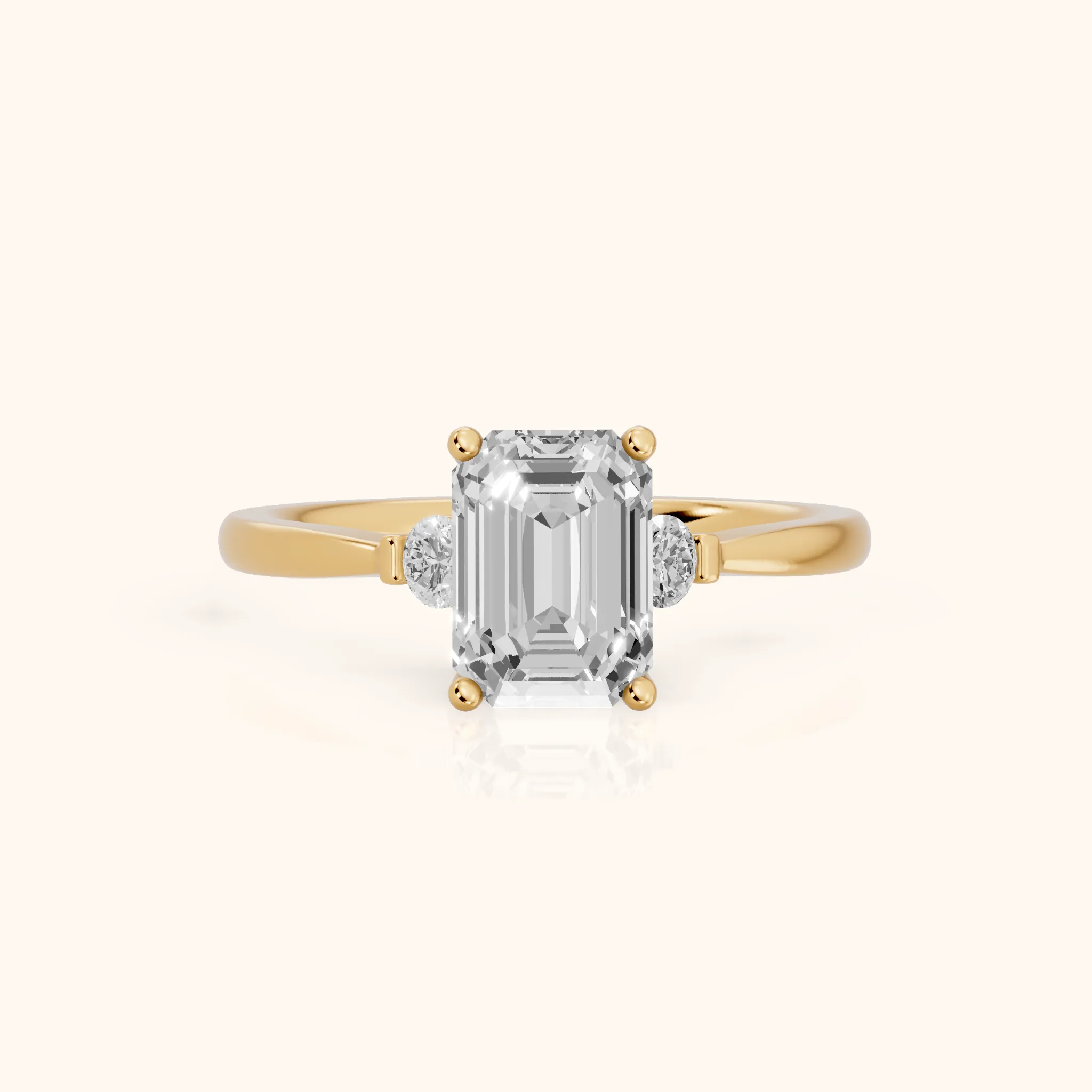 Micaela Three-Stone Emerald Diamond Engagement Ring in Yellow Gold — view 1