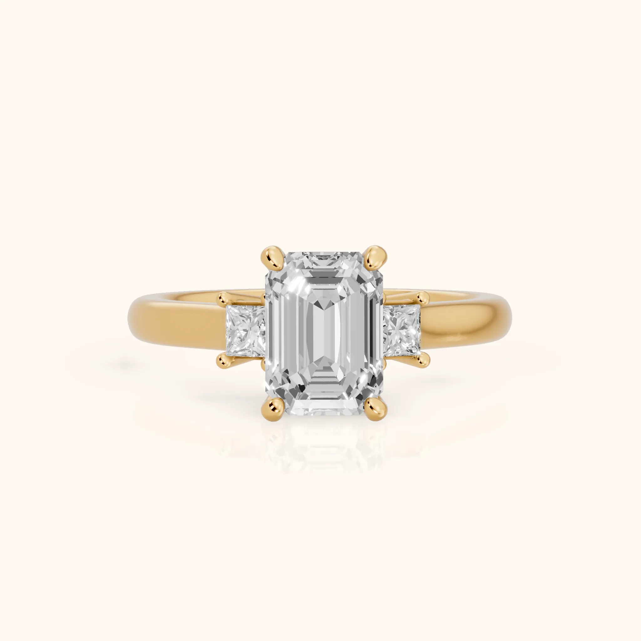 Brenna Three-Stone Emerald Diamond Engagement Ring in Yellow Gold — view 1