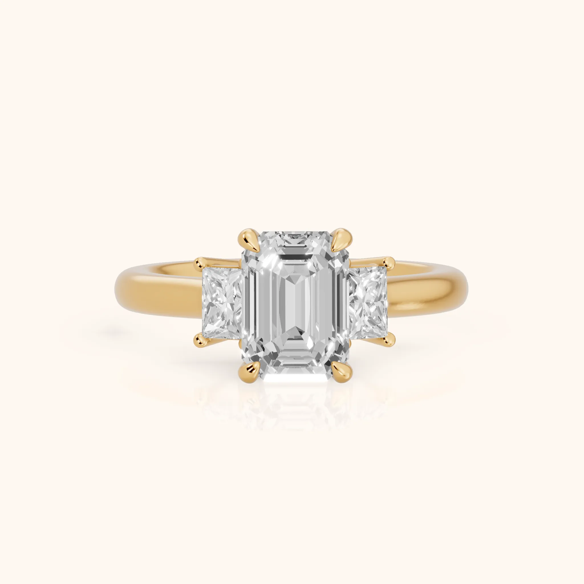Cosette Statement Three-Stone Emerald Diamond Engagement Ring in Yellow Gold — view 1