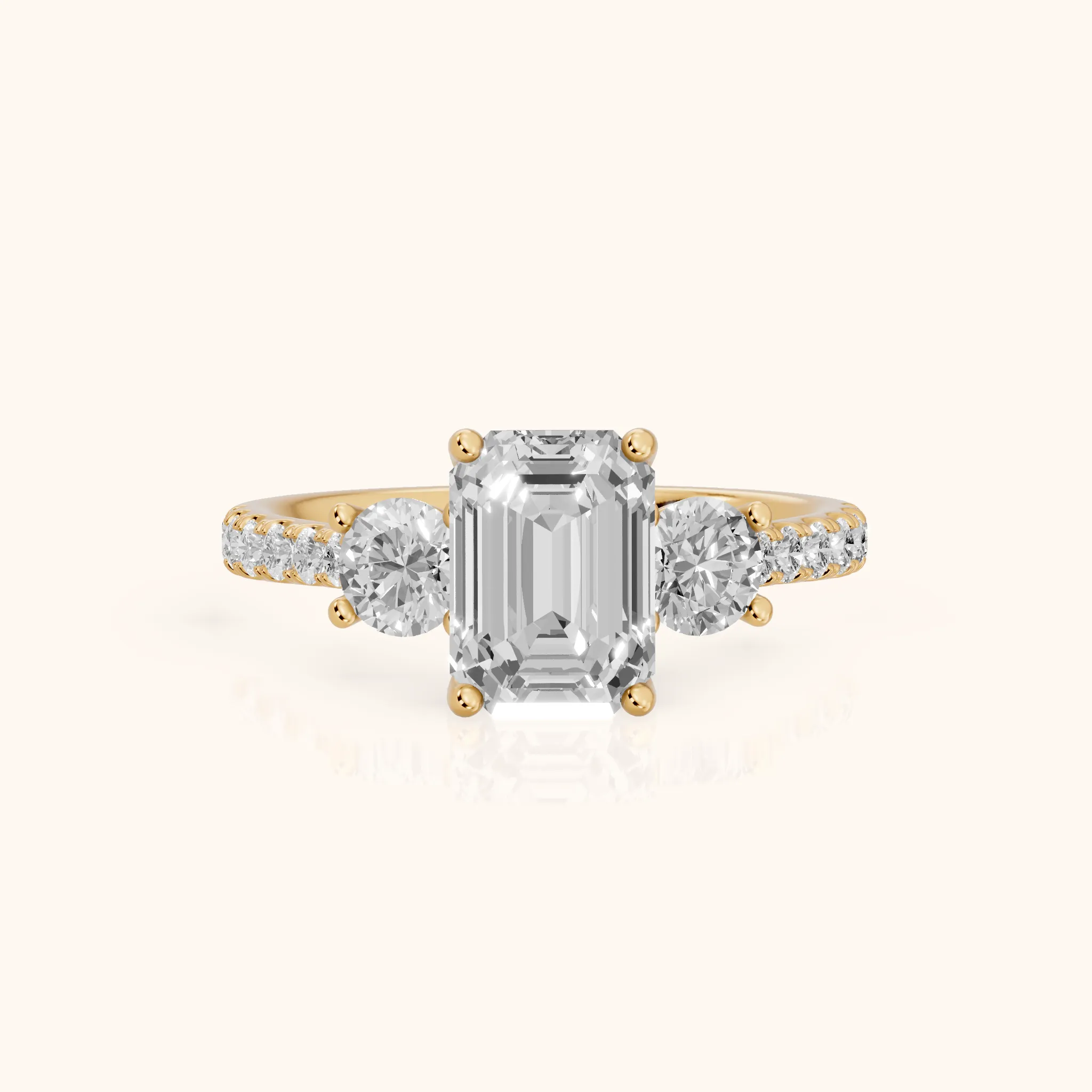 Sibyl Trellis Three-Stone Emerald Diamond Engagement Ring in Yellow Gold — view 1