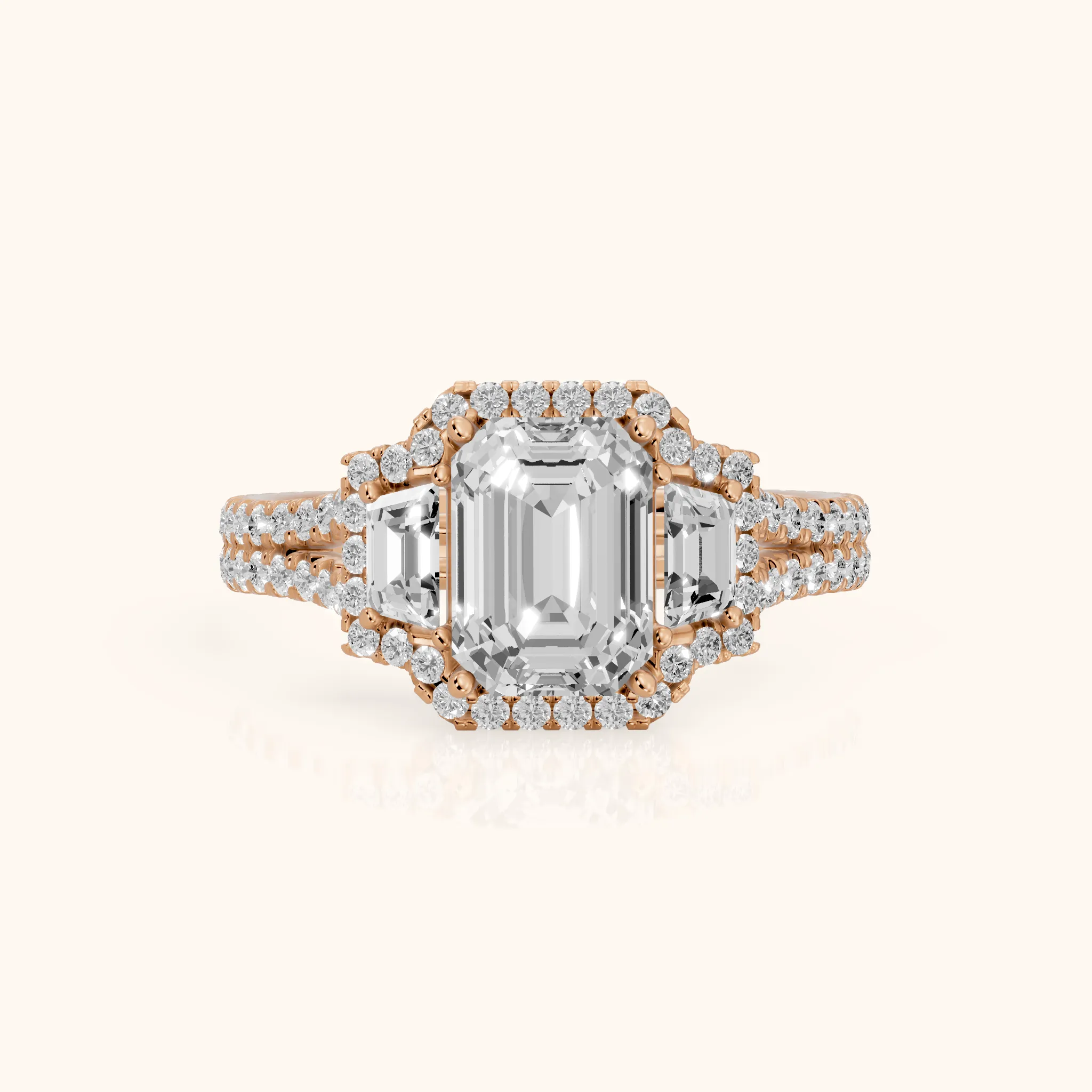 Ronan Three-Stone Halo Emerald Diamond Engagement Ring in Rose Gold — view 1