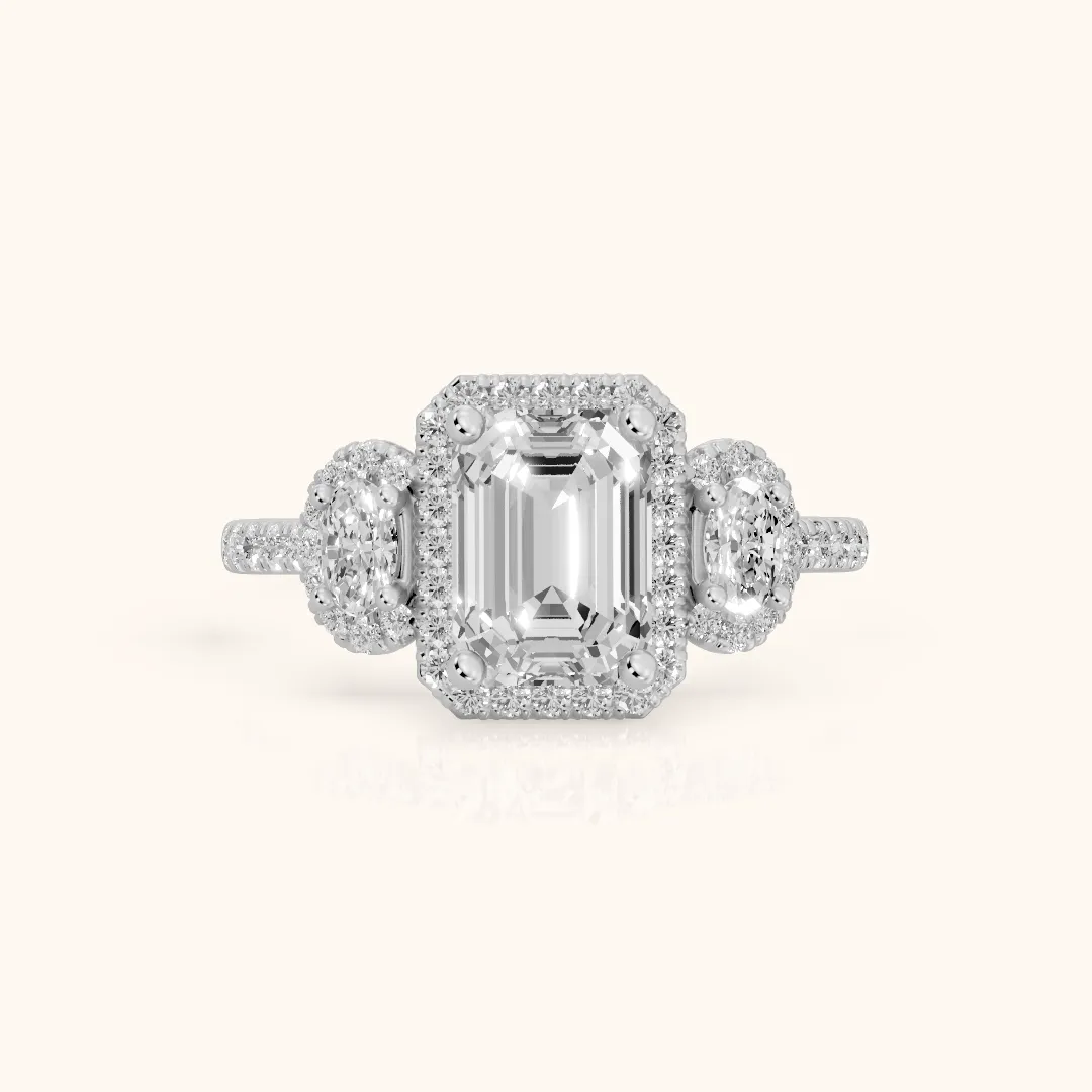 Austin Three-Stone Halo Emerald Diamond Engagement Ring in White Gold — view 2