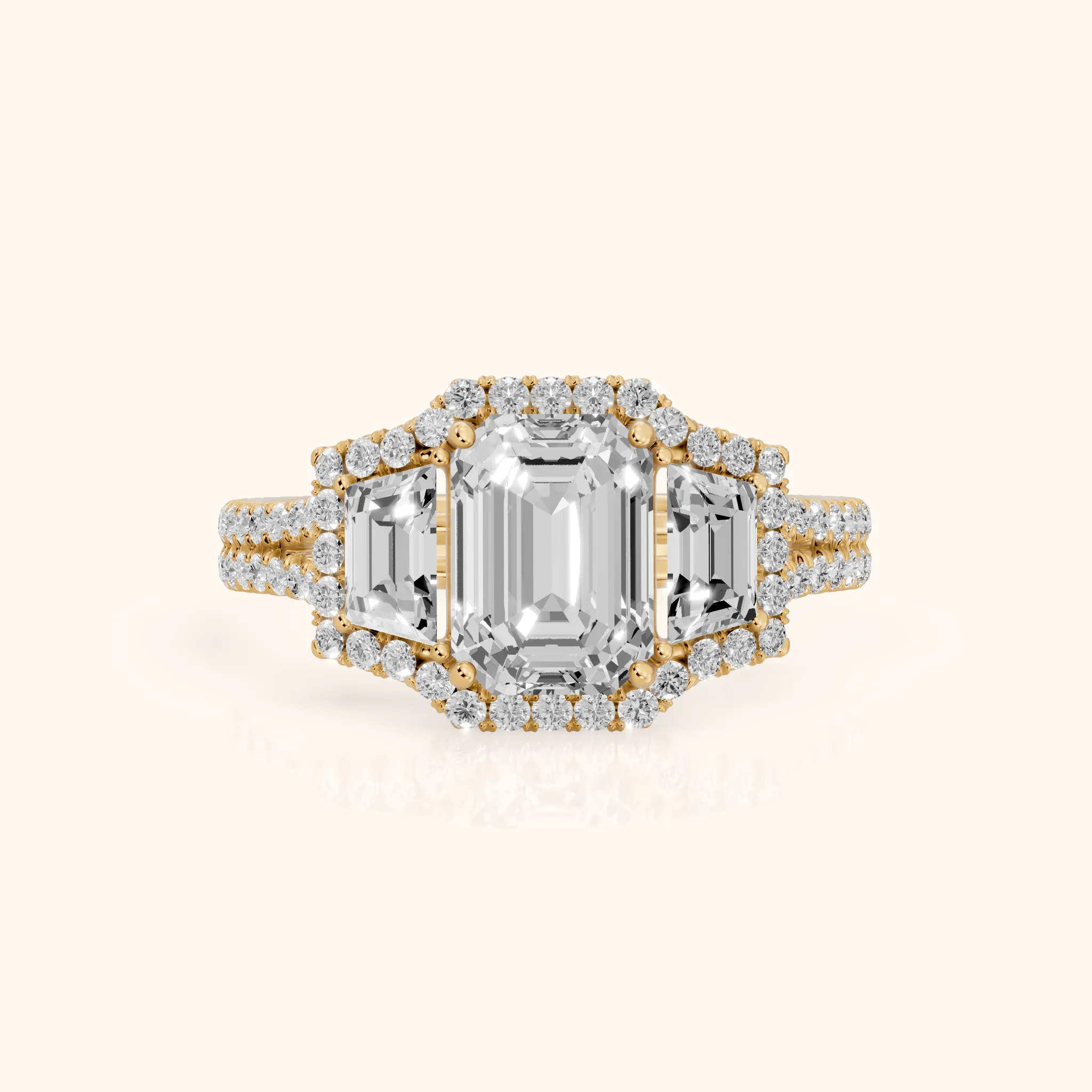 Oakley Three-Stone Split Shank Emerald Diamond Engagement Ring in Yellow Gold — view 1