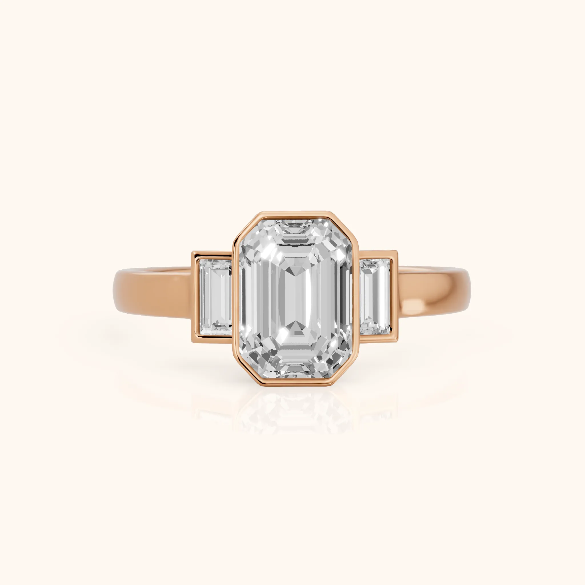 Paia Bezel Three-Stone Emerald Diamond Engagement Ring in Rose Gold — view 1