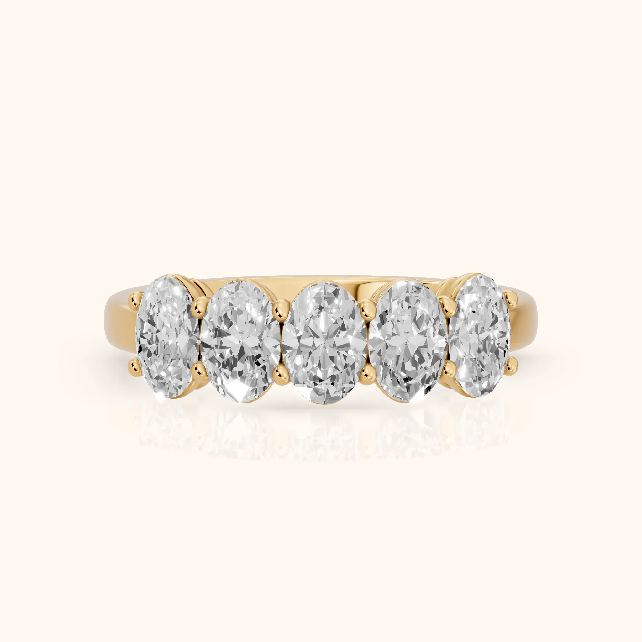 Estela Shared Prong Oval Diamond Wedding Band in Yellow Gold — view 1