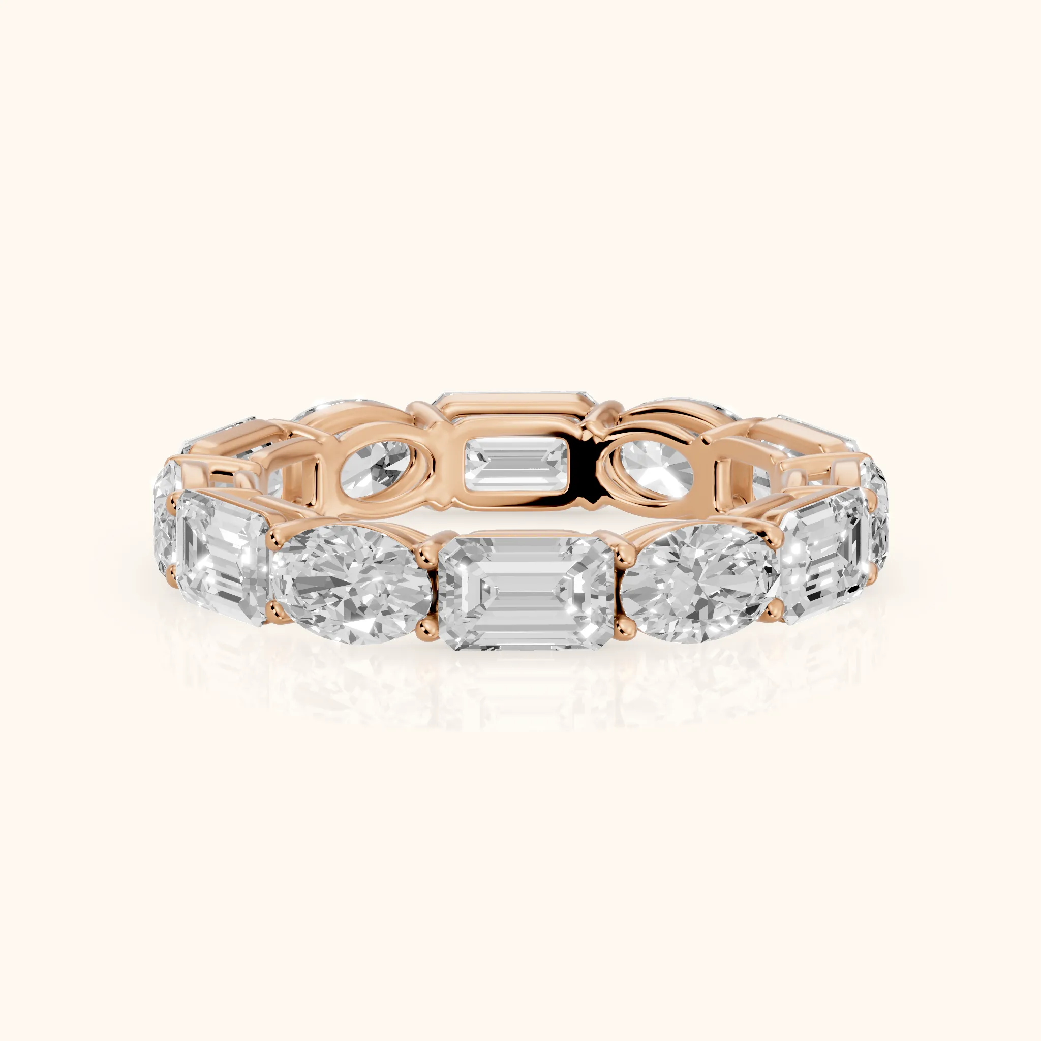 Hema Shared Prong Emerald & Oval Diamond Eternity Band in Rose Gold — view 1