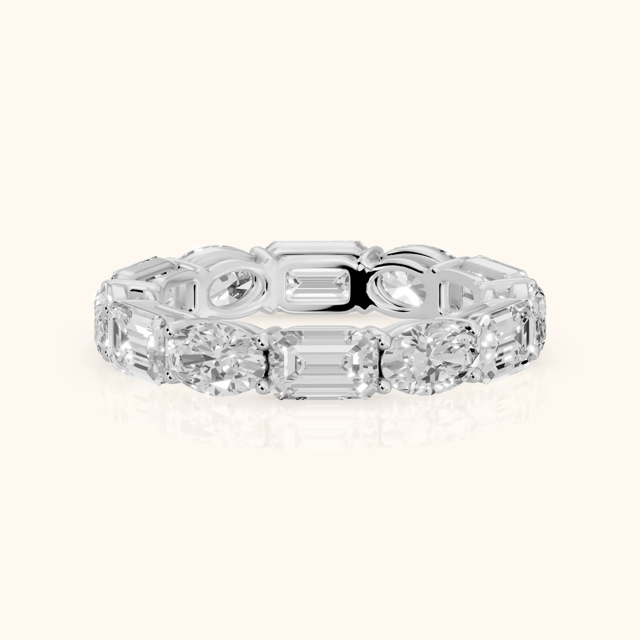 Hema Shared Prong Emerald & Oval Diamond Eternity Band in Platinum — view 1
