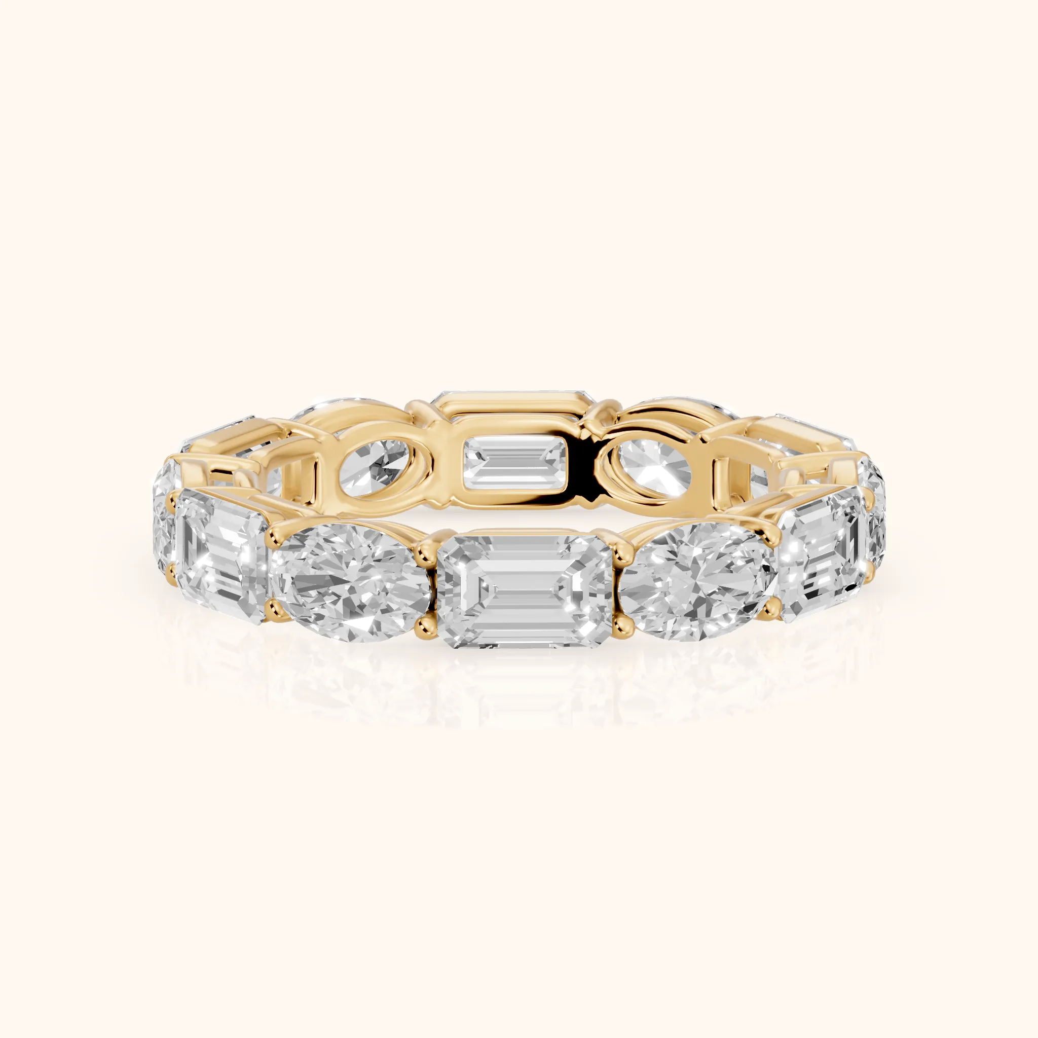 Hema Shared Prong Emerald & Oval Diamond Eternity Band in Yellow Gold — view 1